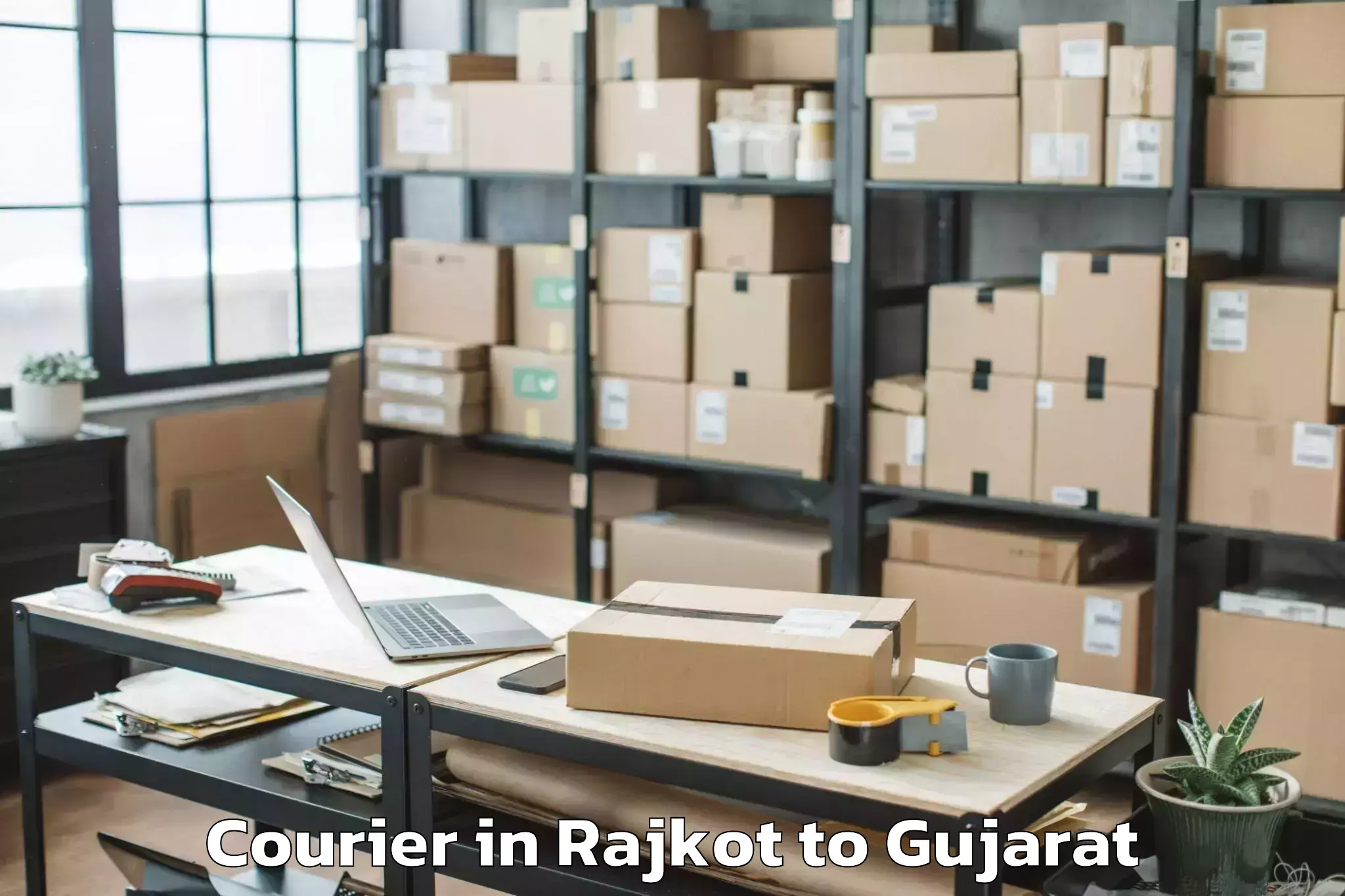 Top Rajkot to Abhilashi University Surat Courier Available